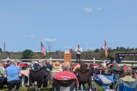 Republican U.S. Senate candidate Mike Rogers on the stage, talking to a crowd
