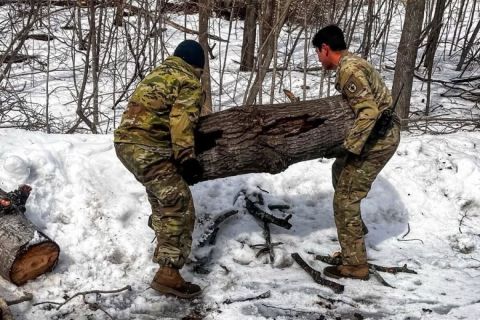 National Guardsmen clear debris from roadway