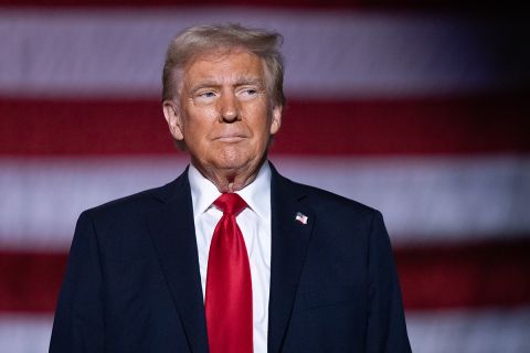 President Donald Trump with an America flag background. 