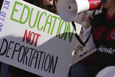 A sign that says "Education not Deportation."