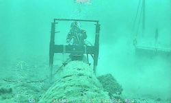 A diver next to Line 5 in the Great Lakes.